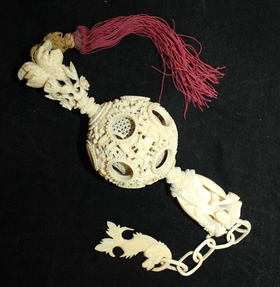 A Chinese export ivory hanging puzzle ball, 19th century, 34cm incl. chain